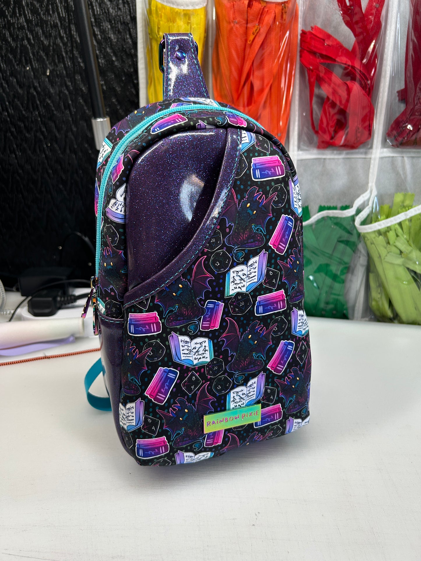 Dice and dragon themed sling bag