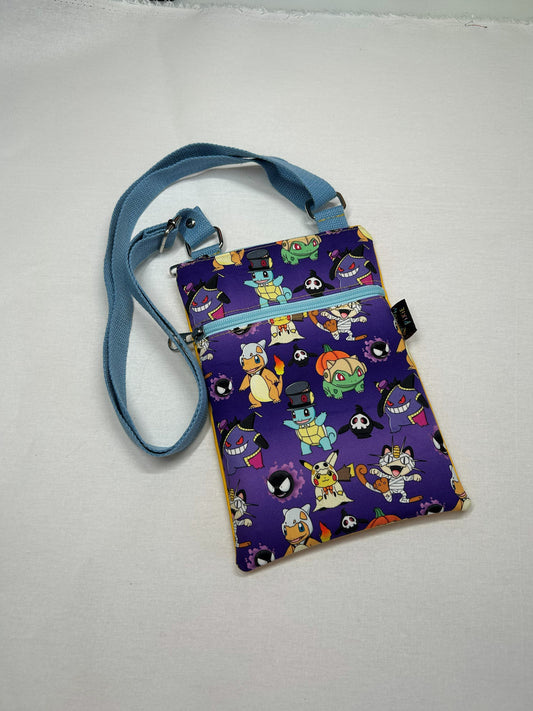 A colorful handbag with a cartoon character pattern printed on it, featuring various characters from popular pop culture.