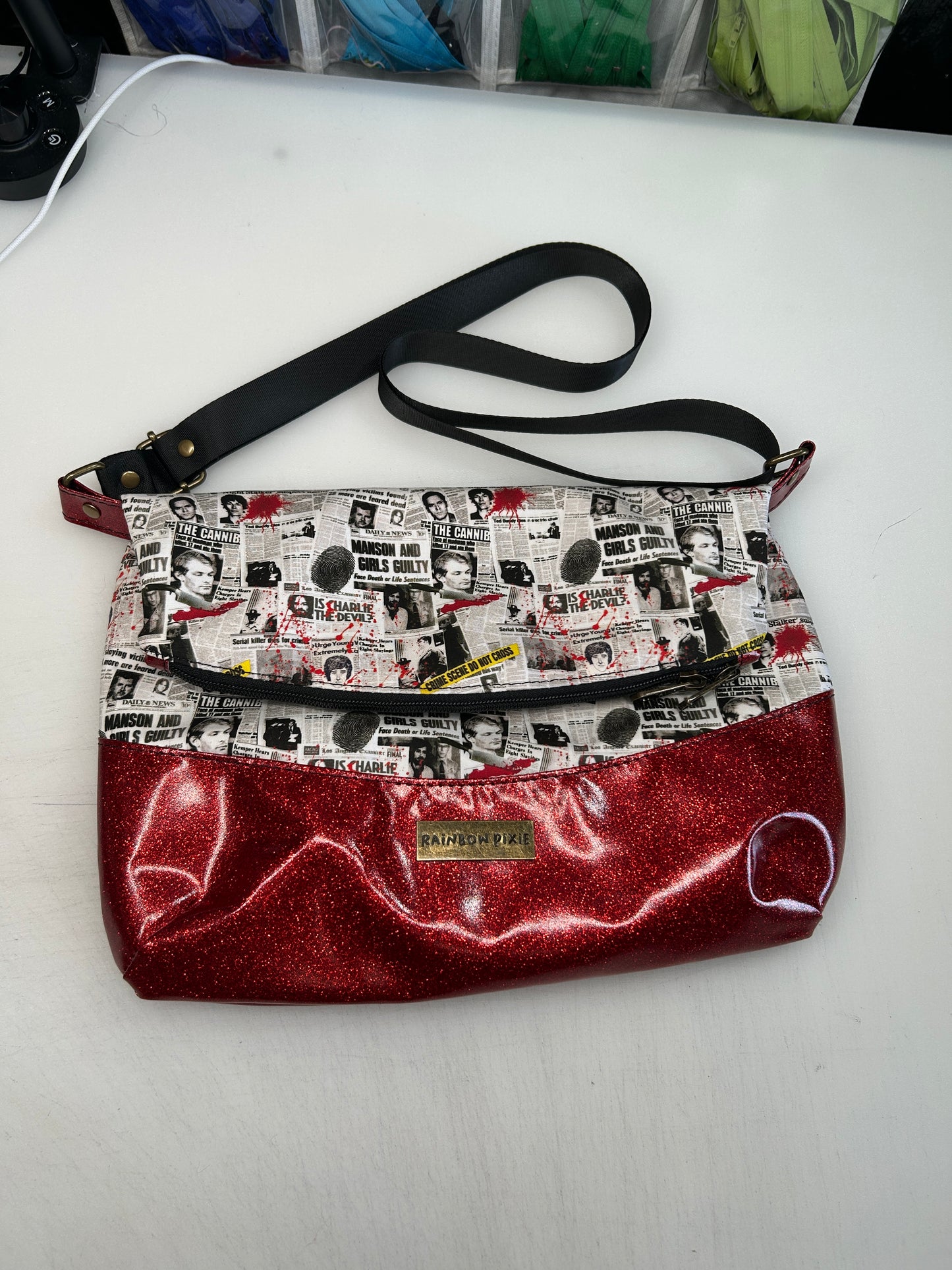 True crime Themed foldover crossbody bag with red glitter bottom