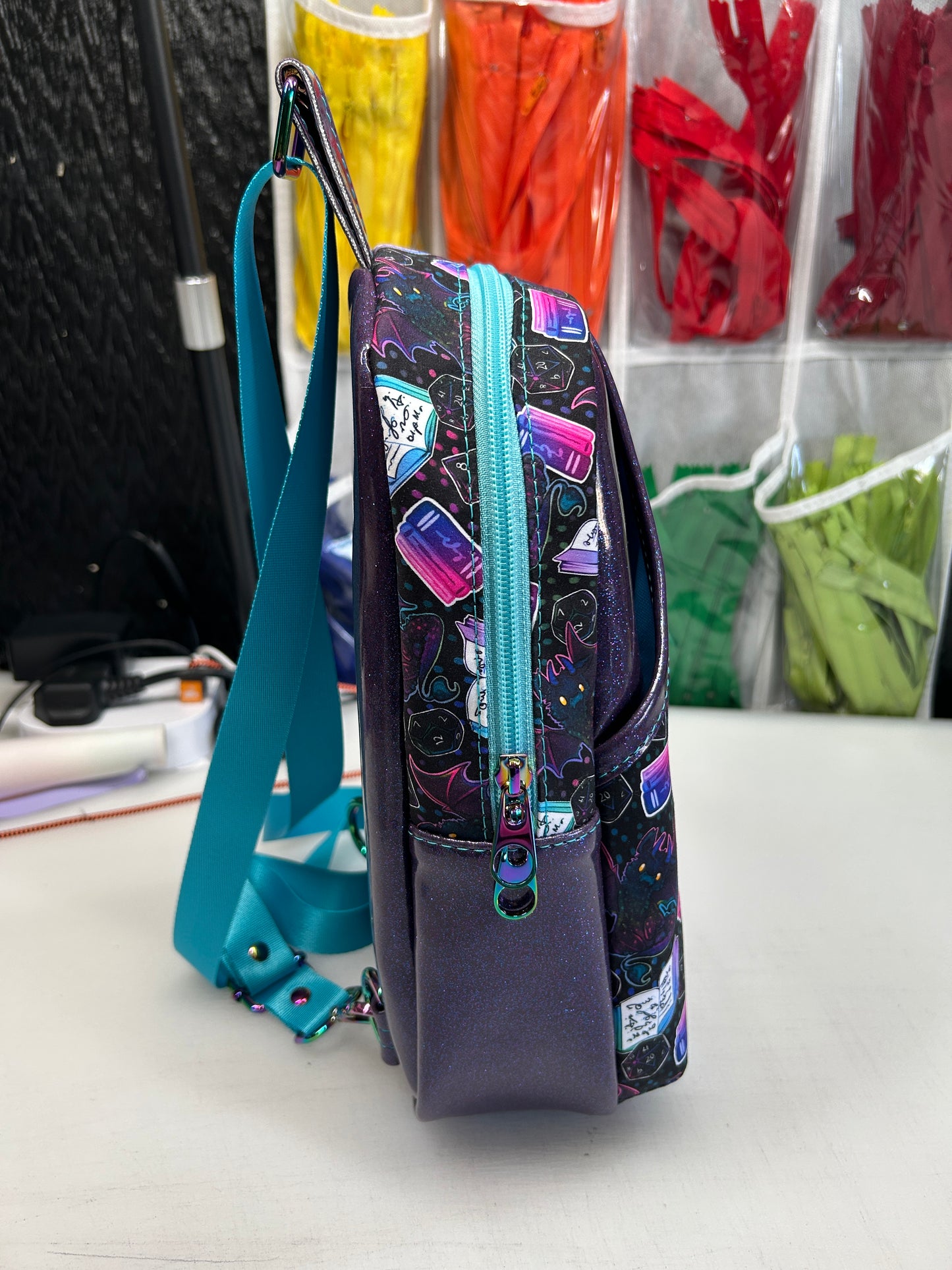 Dice and dragon themed sling bag