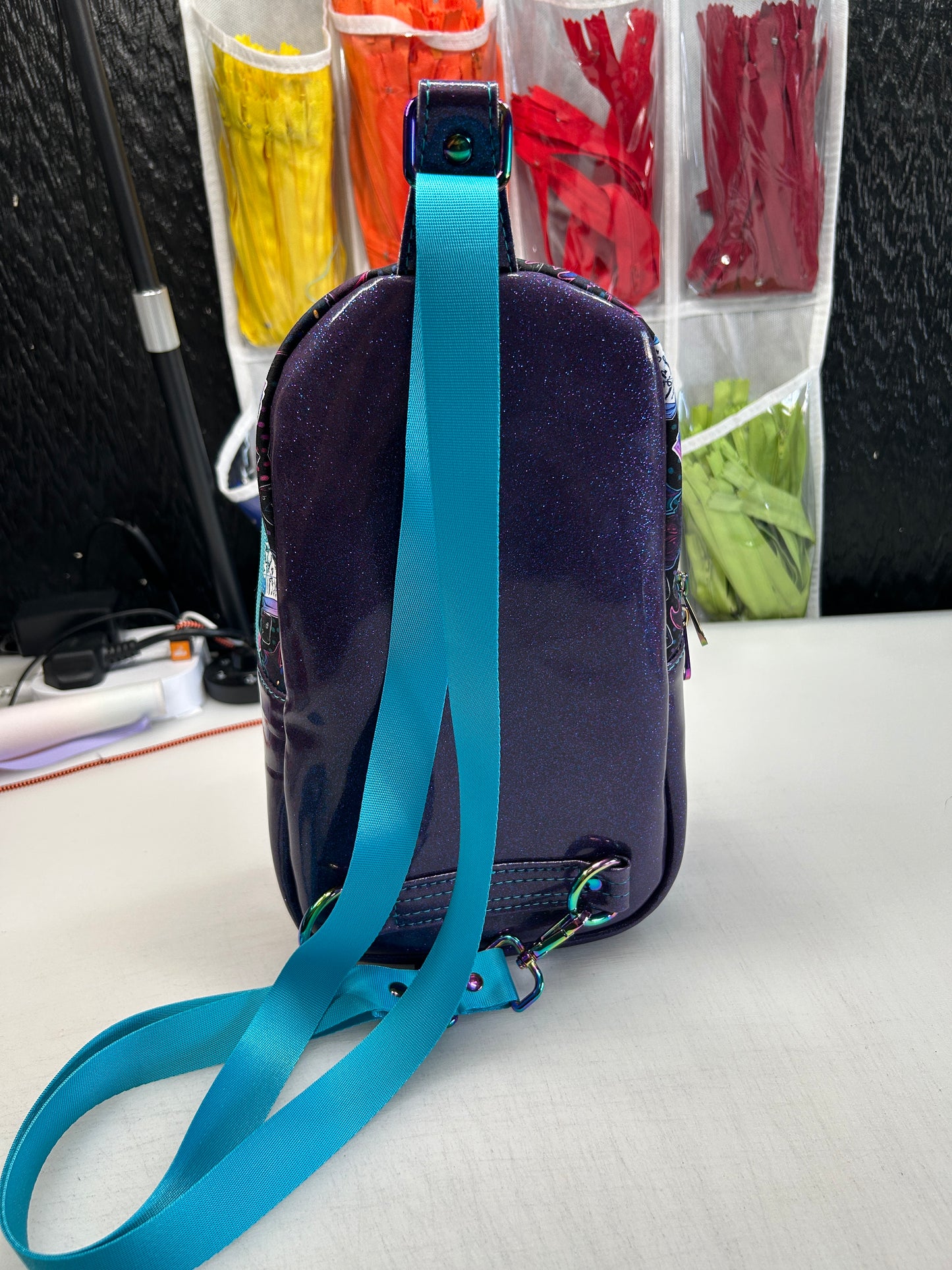 Dice and dragon themed sling bag