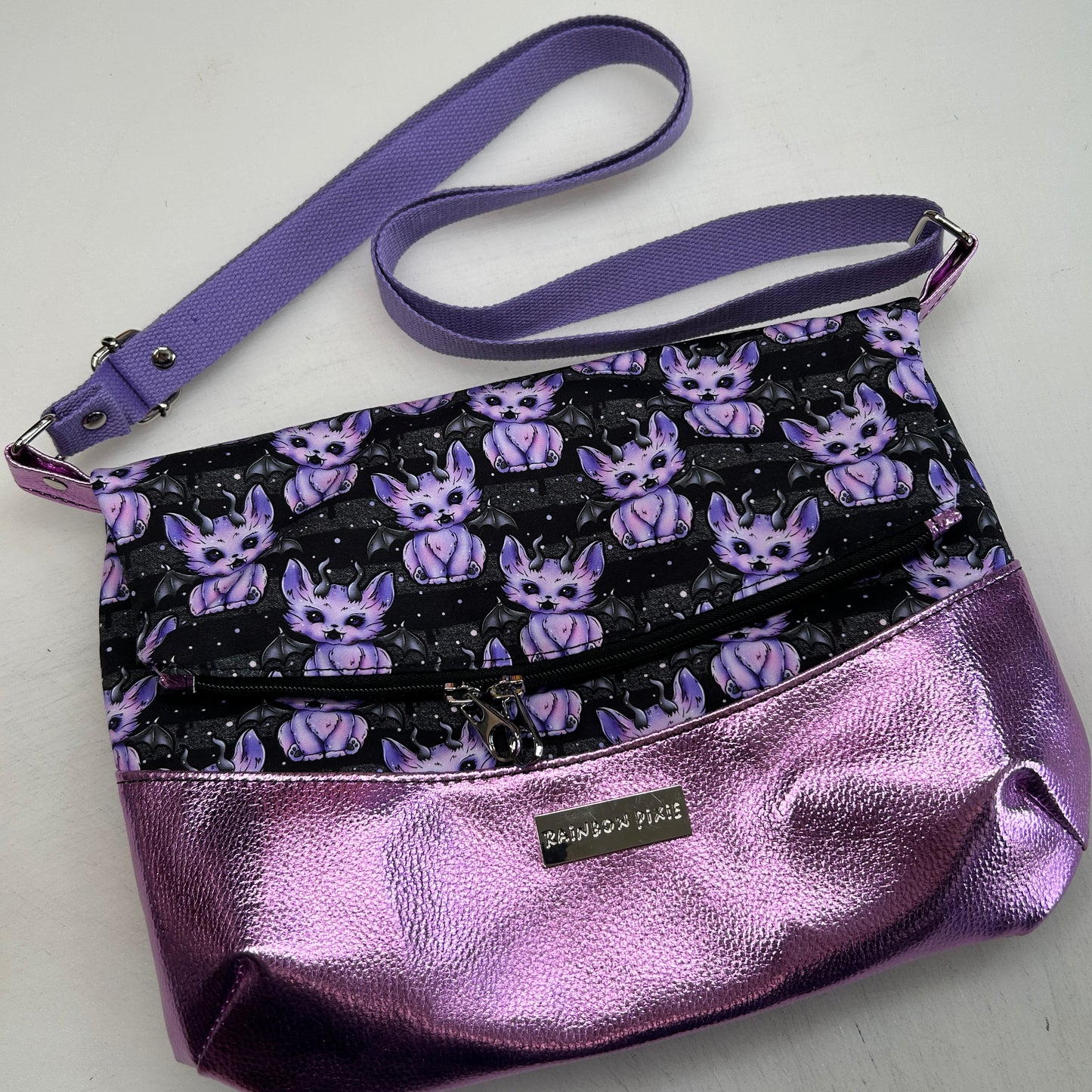 Demon cats Themed foldover crossbody bag with glitter bottom