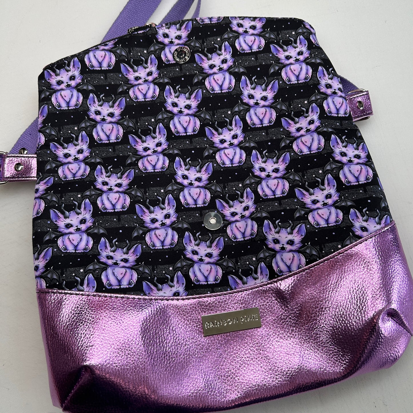 Demon cats Themed foldover crossbody bag with glitter bottom