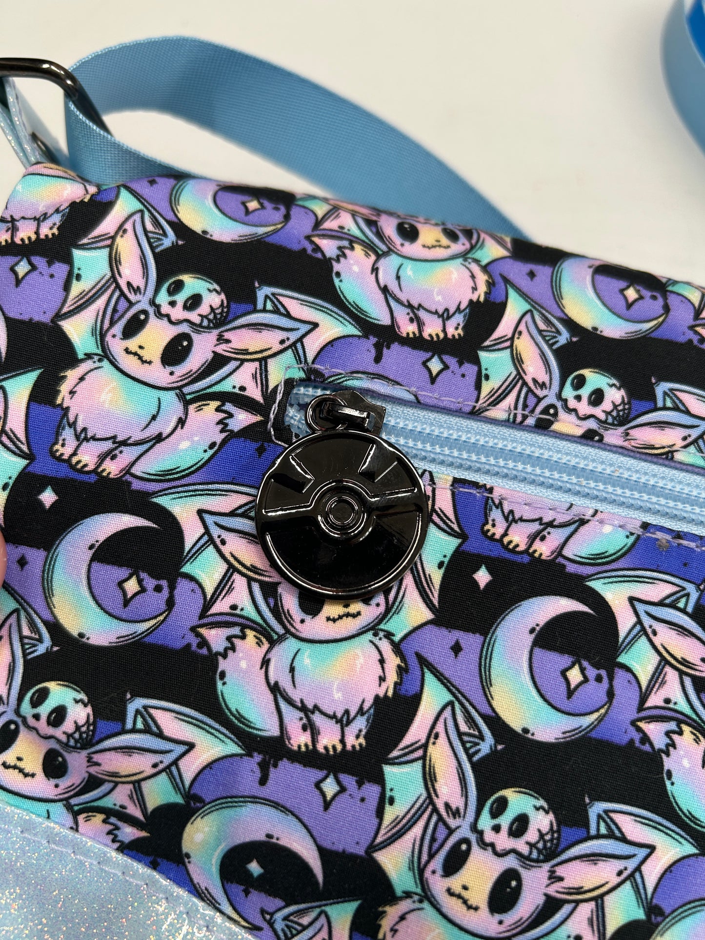 Spooky Eevee Themed foldover crossbody bag with glitter bottom