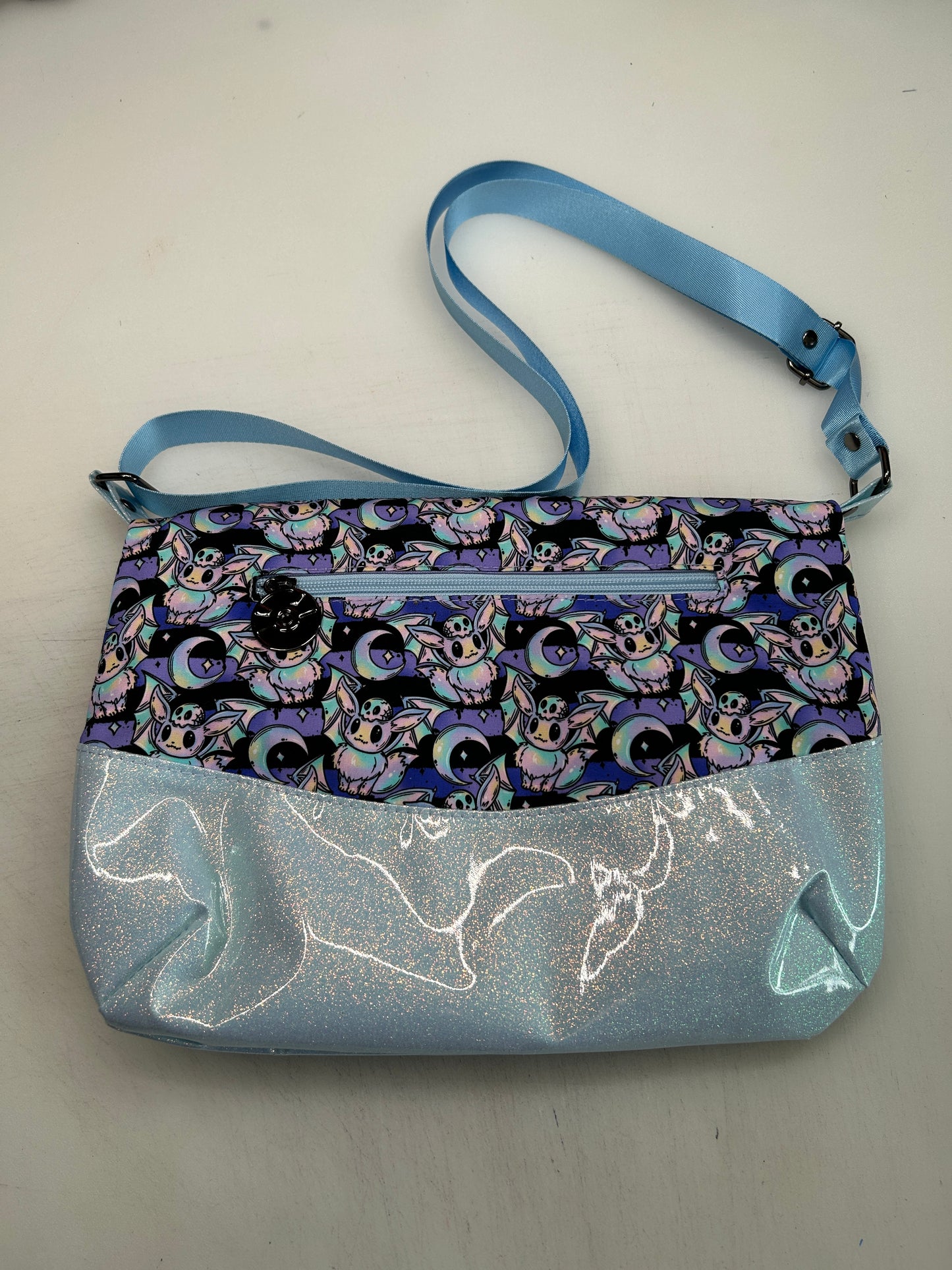 Spooky Eevee Themed foldover crossbody bag with glitter bottom