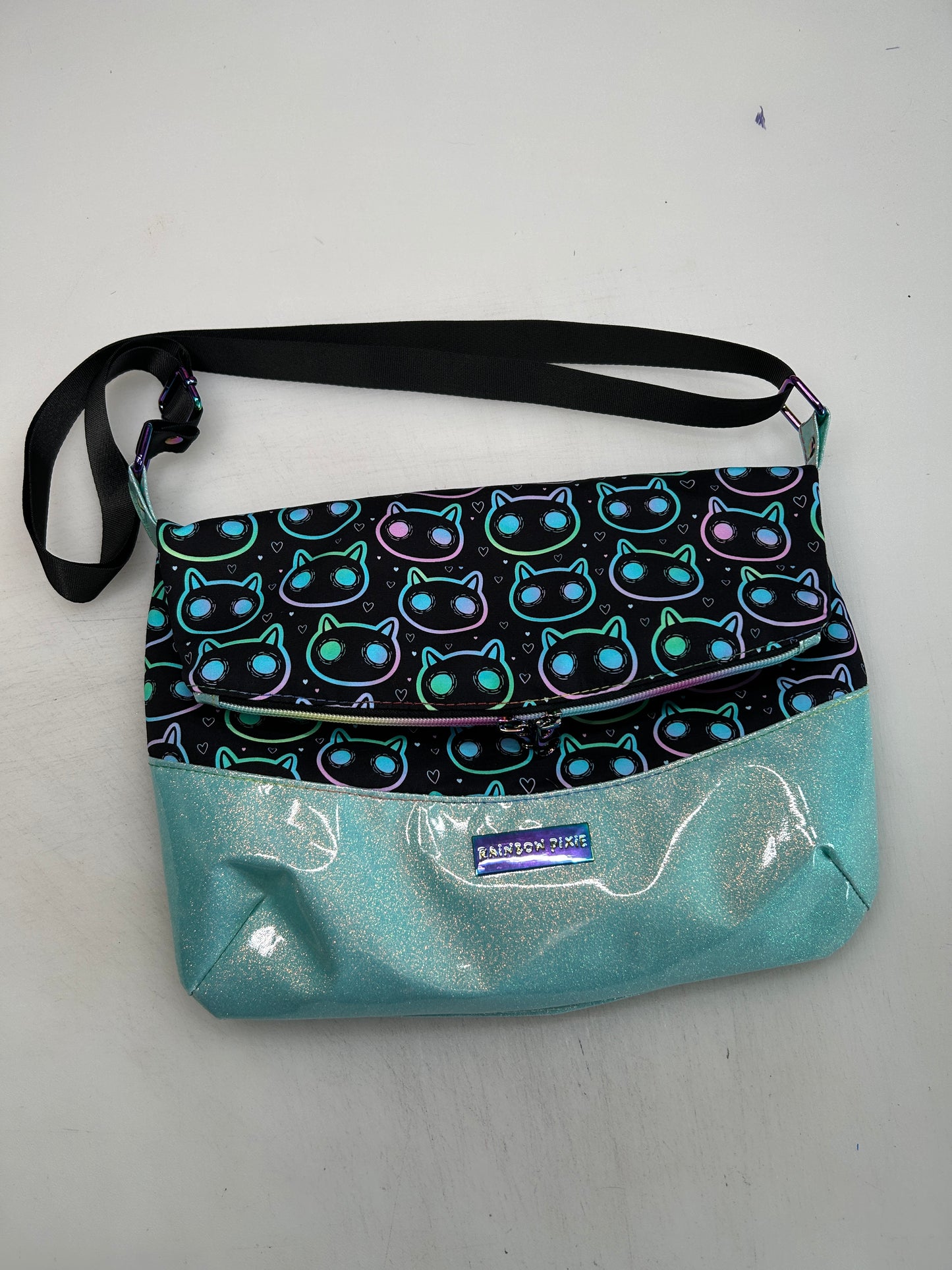 Neon Cat Themed foldover crossbody bag with glitter bottom