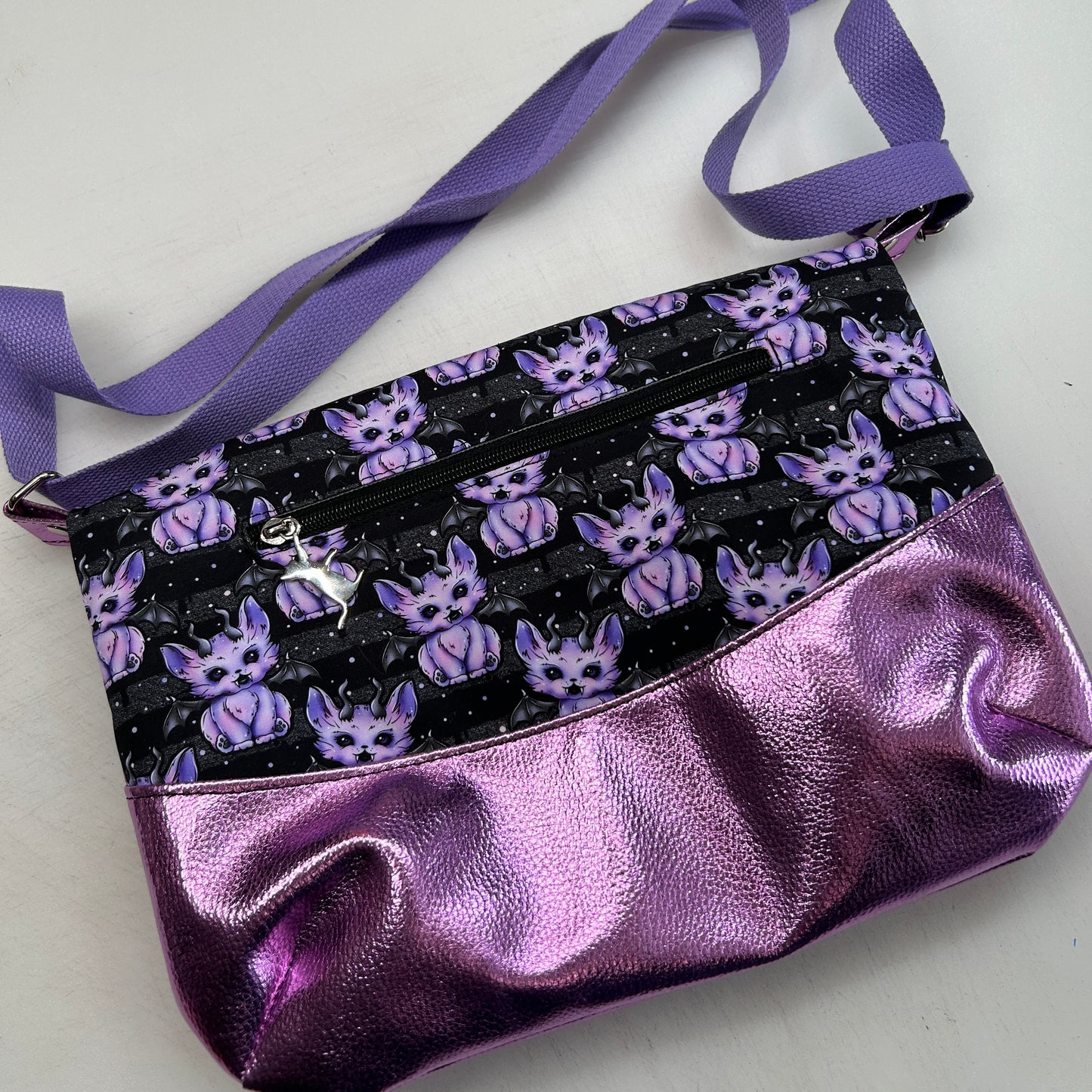Demon cats Themed foldover crossbody bag with glitter bottom