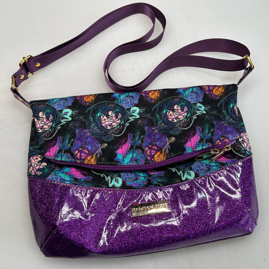 Dragons and Dice Themed foldover crossbody bag with purple glitter bottom