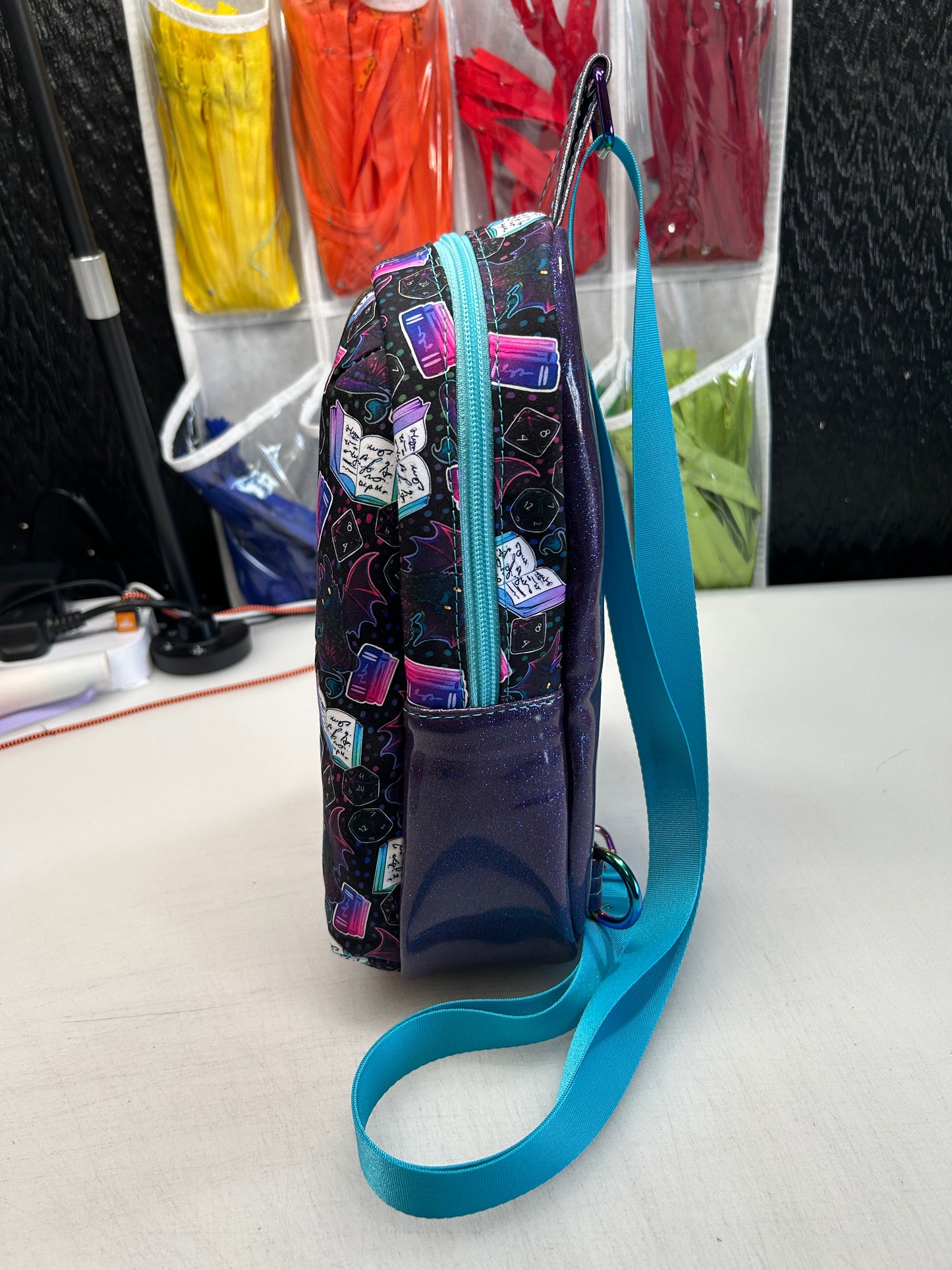 Dice and dragon themed sling bag