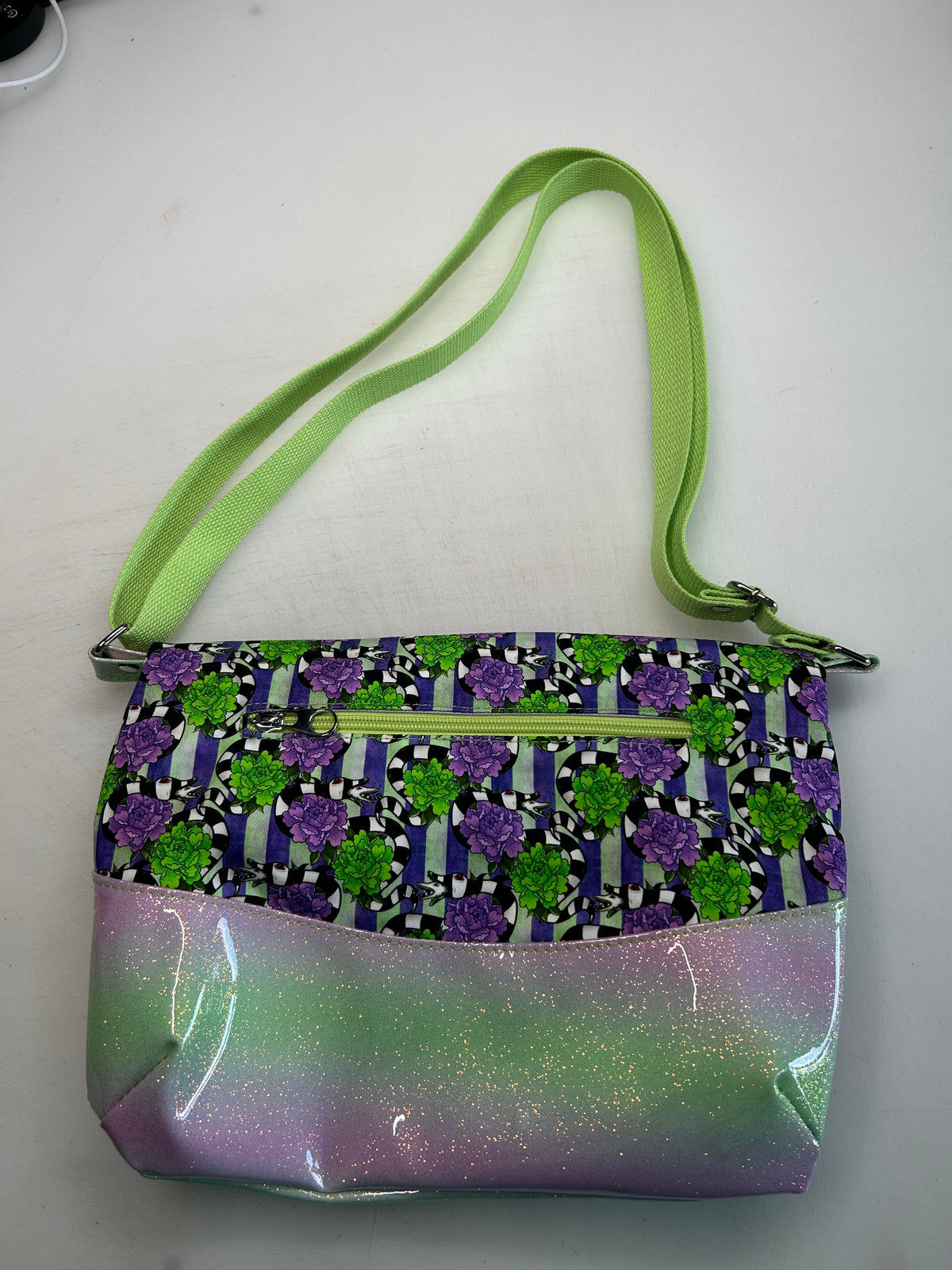 Beetlejuice Themed foldover crossbody bag with pastel glitter bottom