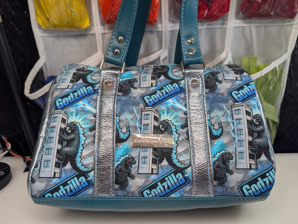Godzilla barrel bag