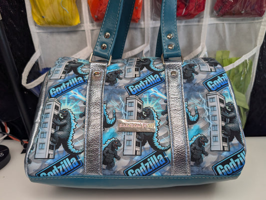 Godzilla barrel bag
