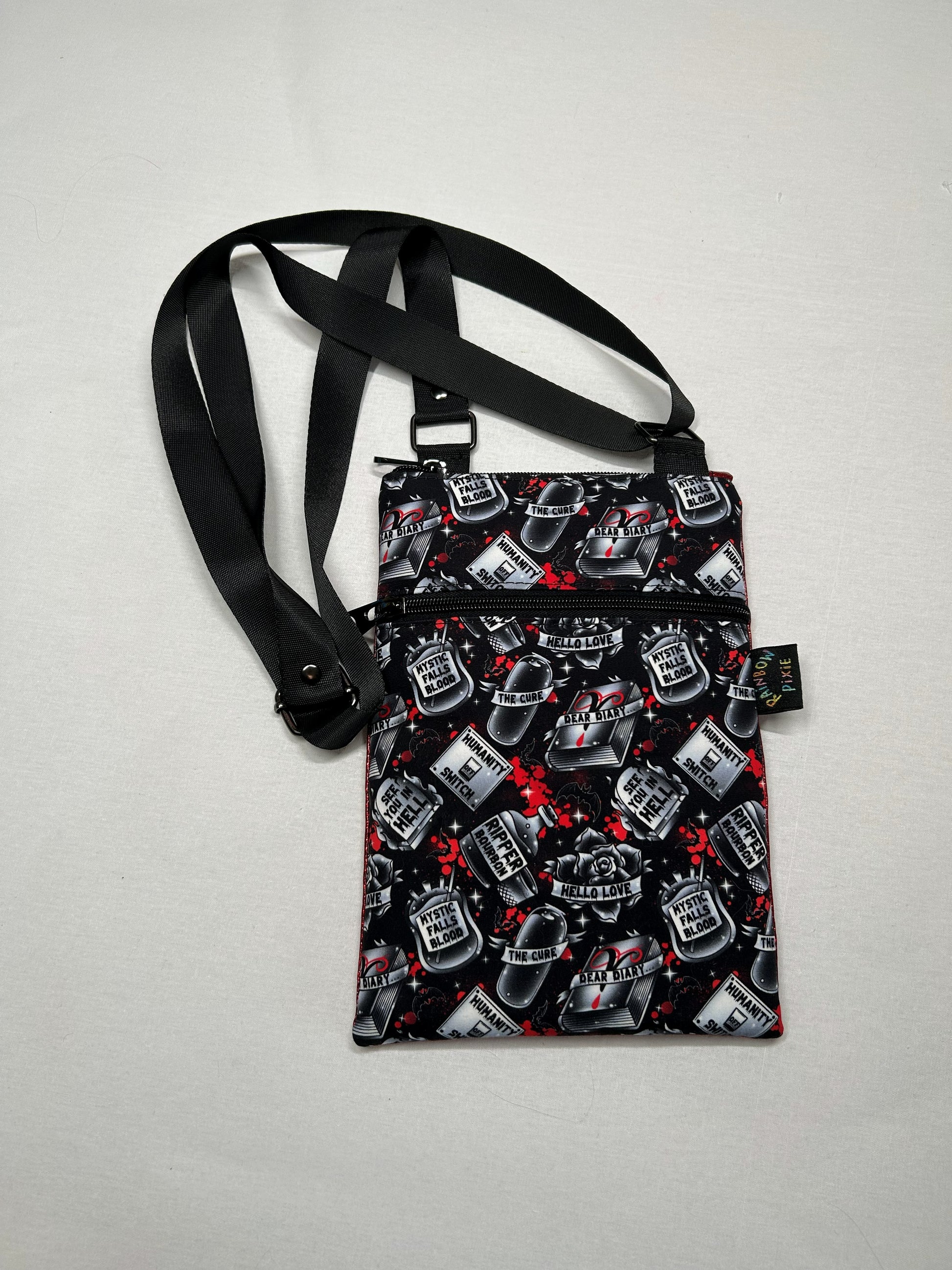 A black and red patterned bag with various icons printed on it, including a skull and crossbones, a phone, and other symbols.