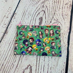 Load image into Gallery viewer, a small pouch with a pattern of cartoon characters on it
