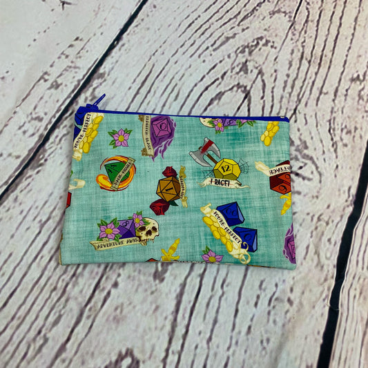 a small zippered pouch on a wooden surface